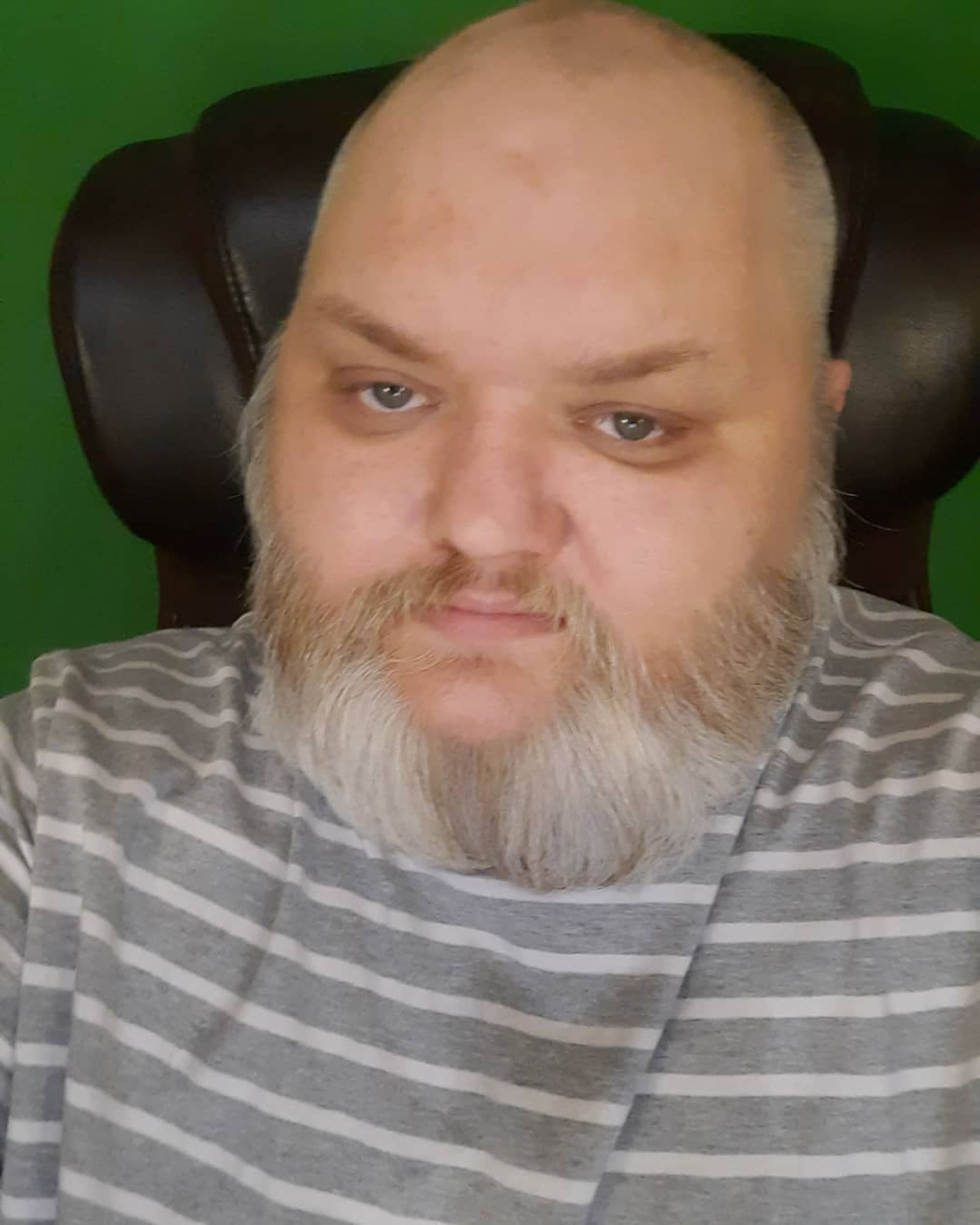KingBeardX in a chair. 