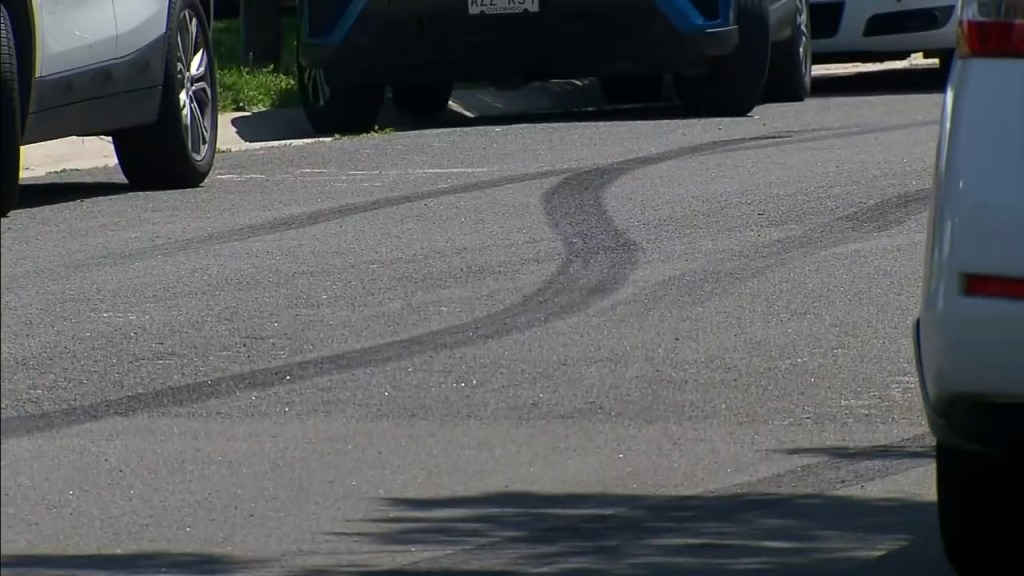 Tire marks left on the street after the teens crashed during the shooting.