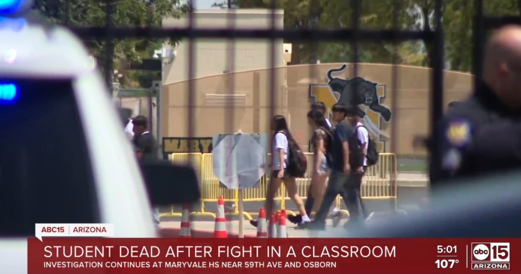 Students walking past a high school after a classroom fight resulted in a student's death.