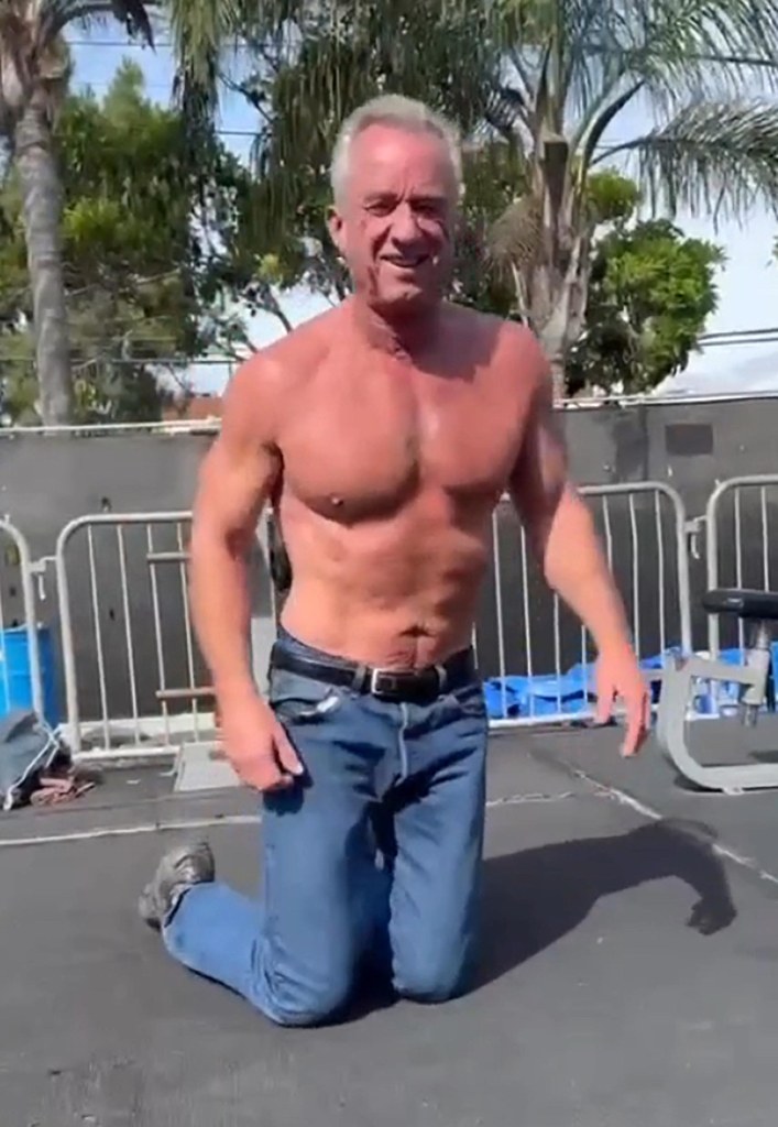 Robert F. Kennedy Jr. kneeling outdoors, shirtless, during a workout.