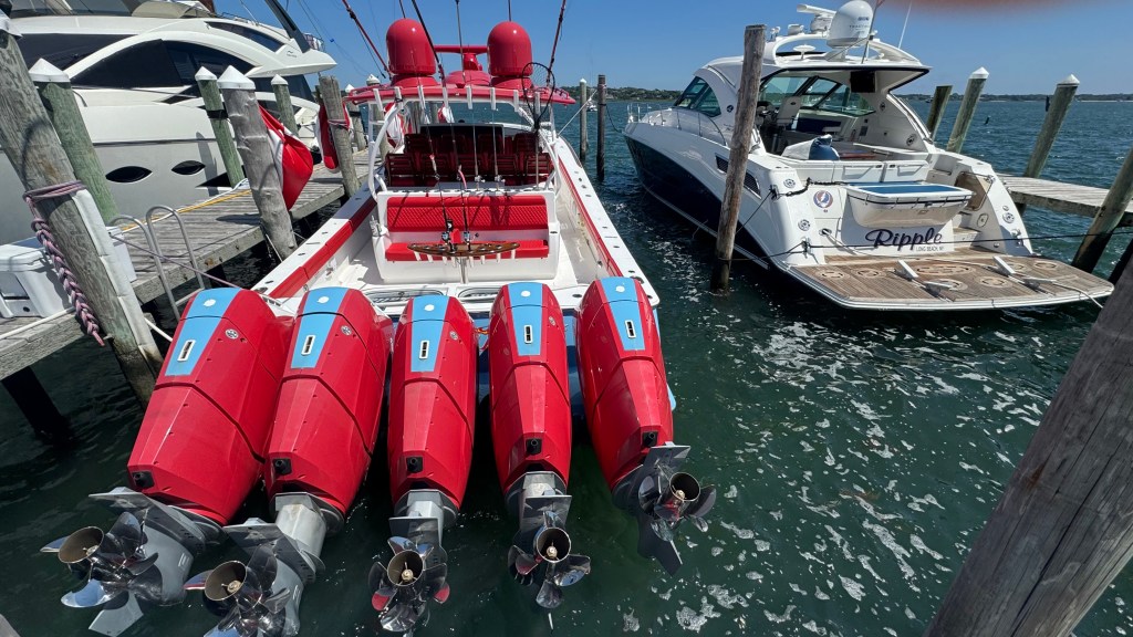 The Ripple, a fast boat, docked at a marina.
