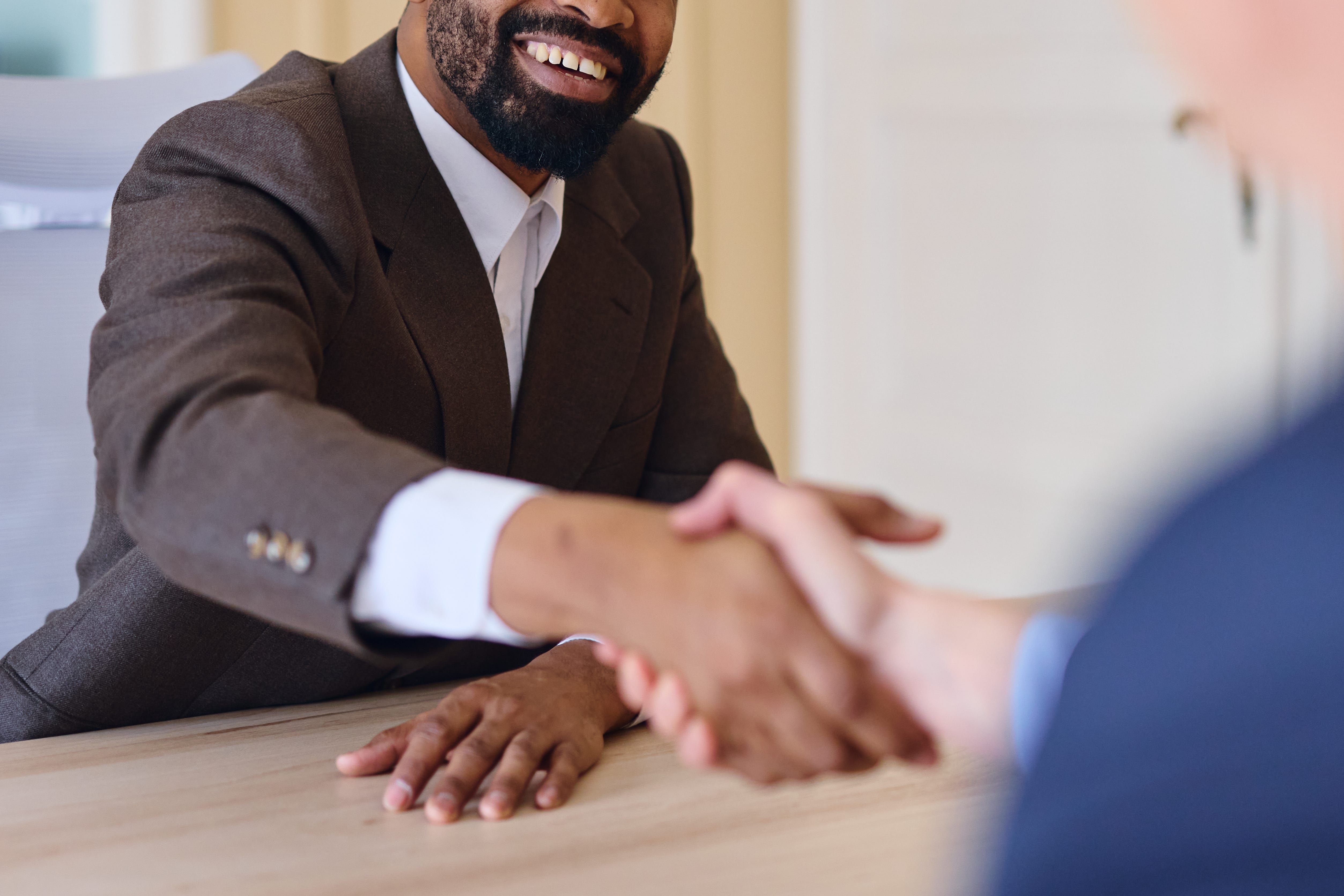 Men in suits shaking hands