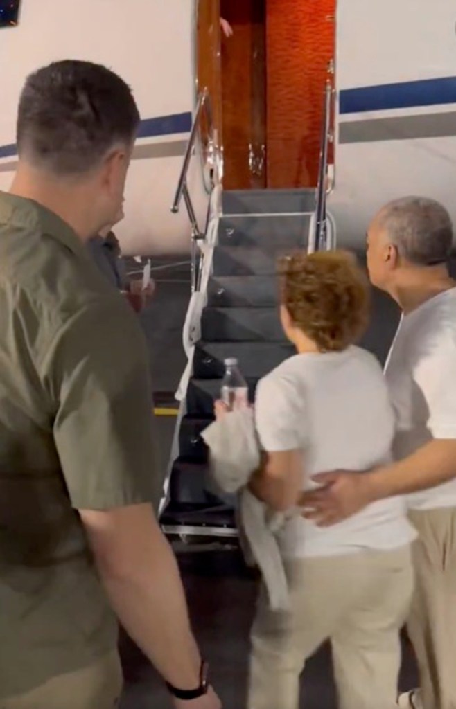 Paul and Christy Akeo getting on a plane.