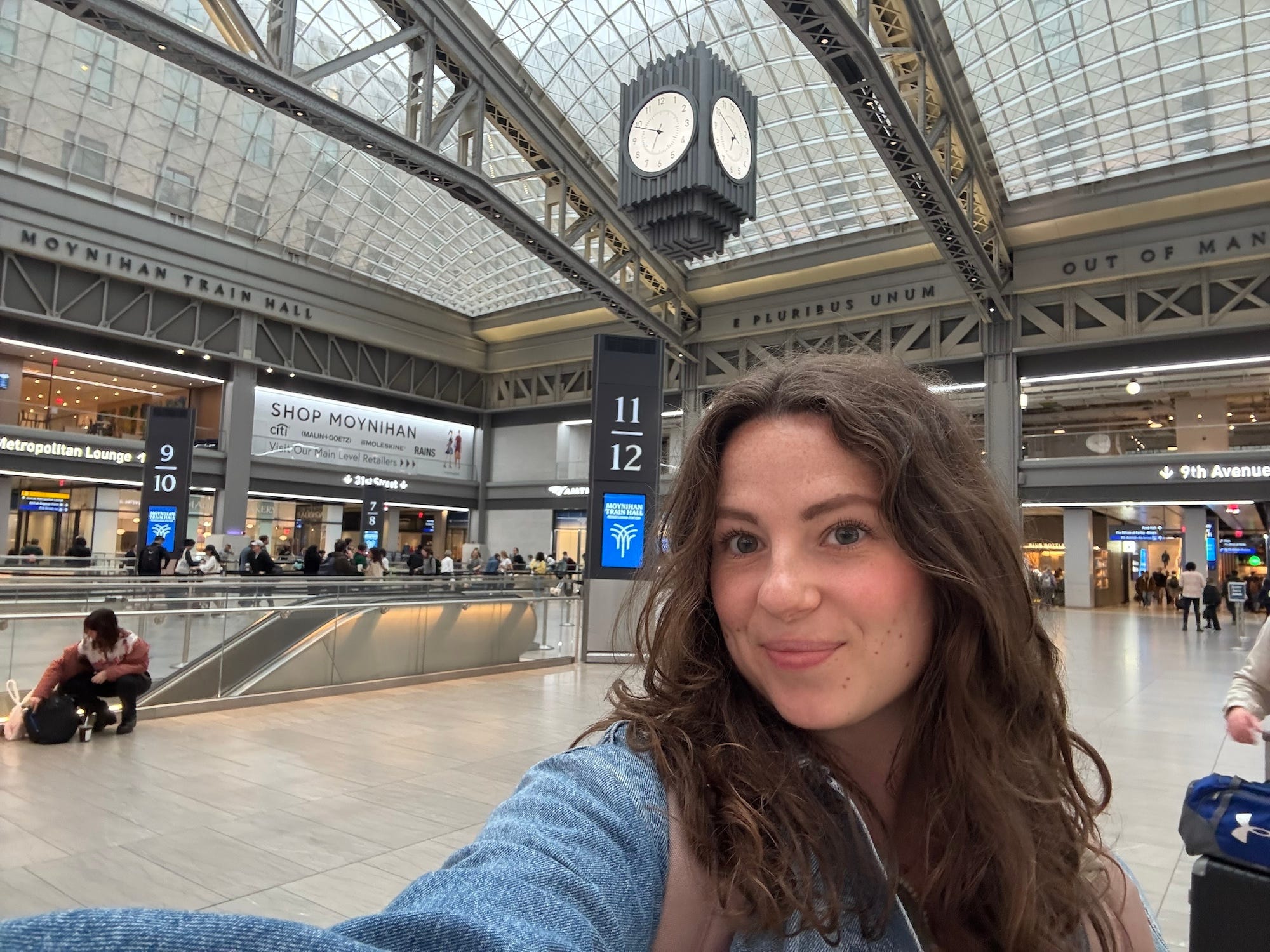 A selfie of a woman at Moynihan Train Hall at Penn Station.