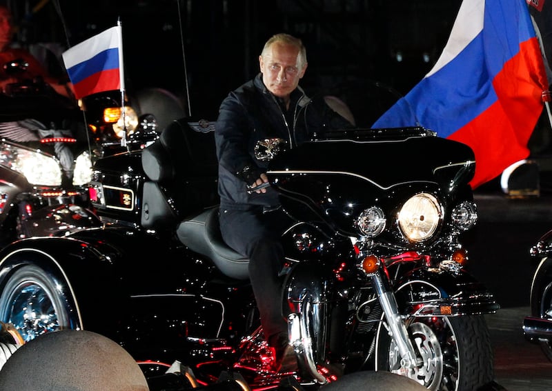 Russian Prime Minister Vladimir Putin rides a motorcycle on August 29, 2011 at a bikers' festival in the Black Sea port of Novorossiysk, Russia. Putin described leather-clad bikers as brothers and boasted of the 