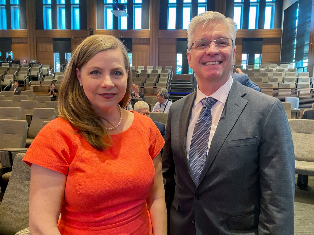 Photo of Federal Reserve Governors Michelle Bowman and Christopher Waller at a conference.