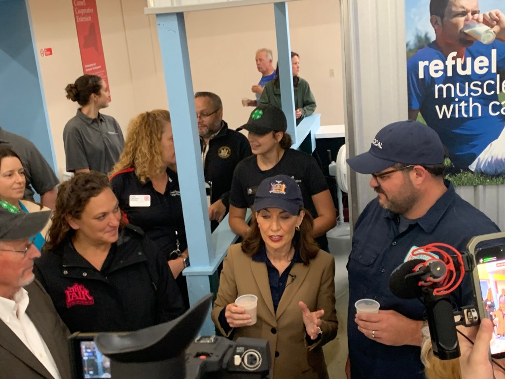 Hochul at the State Fair, sampling dairy products.