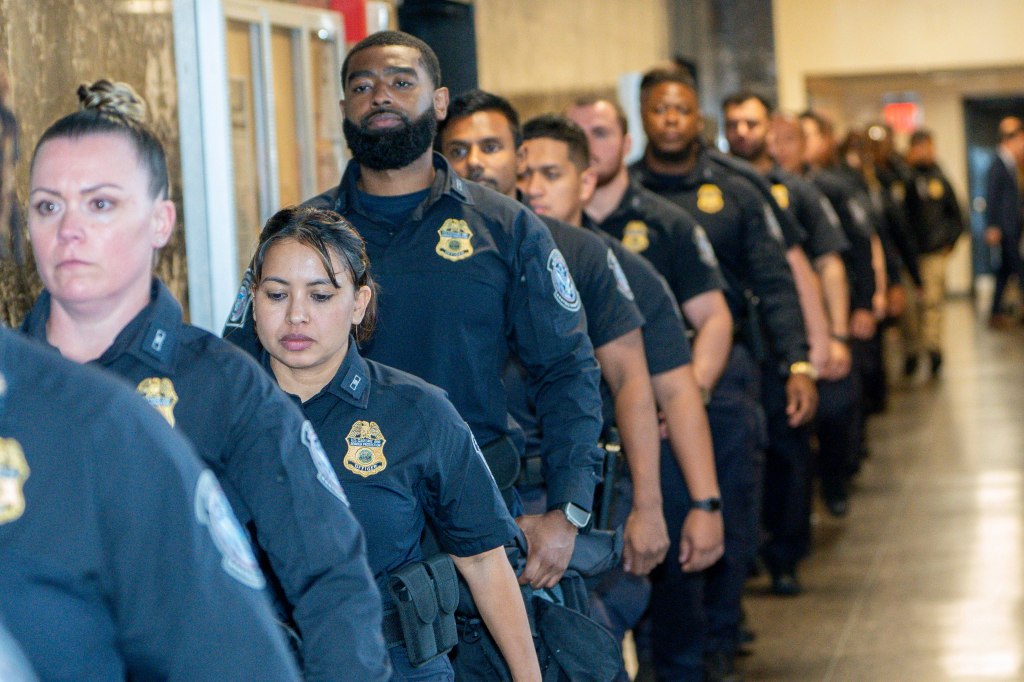Border Patrol agents leaving court.