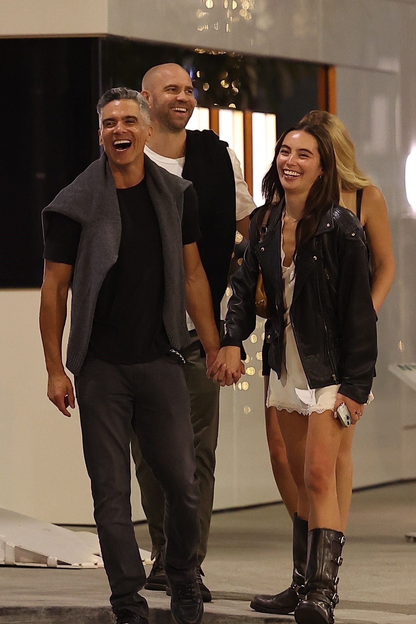 Hana Sun Doerr and Cash Warren hold hands. 
