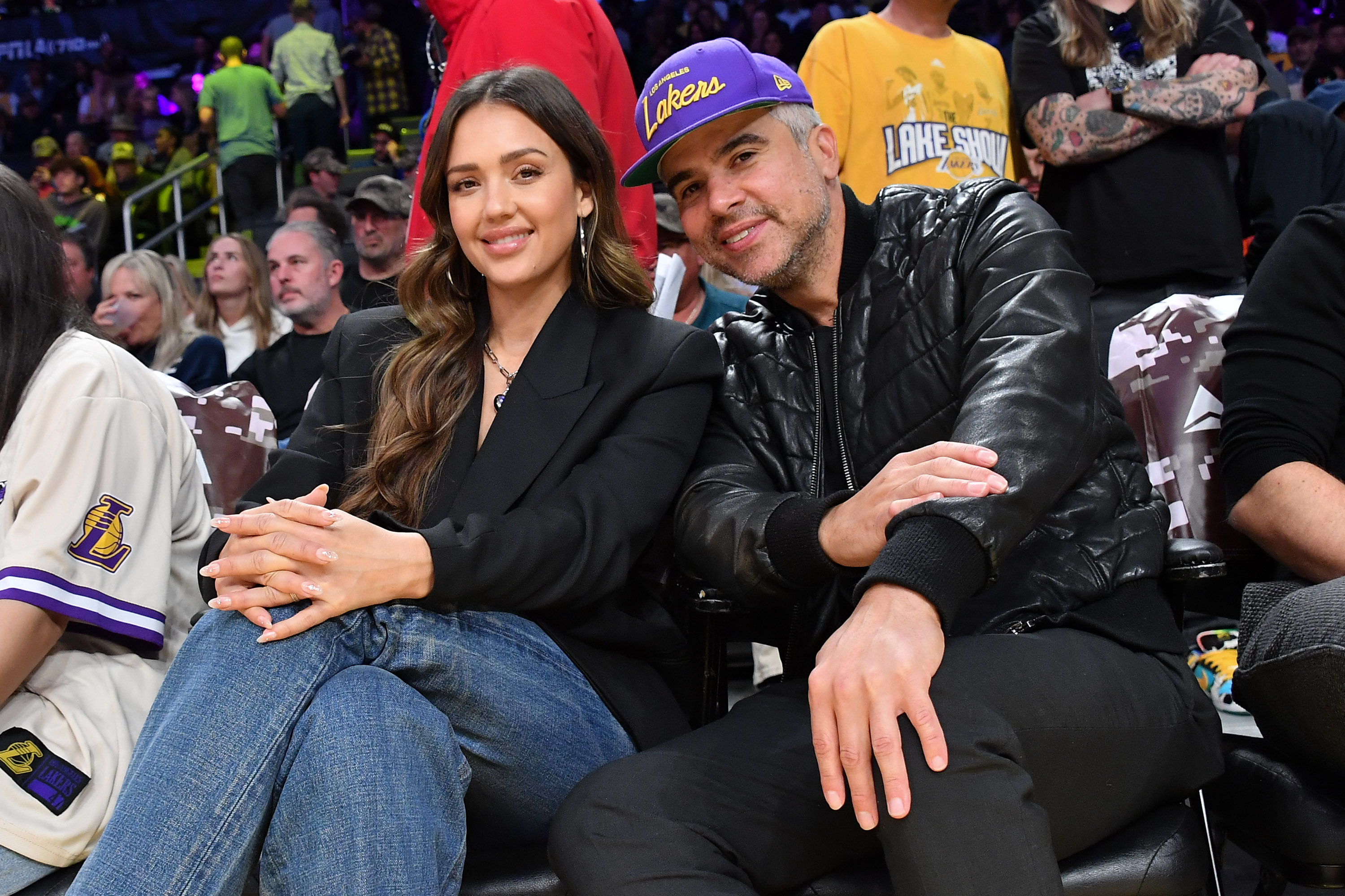 Jessica Alba and Cash Warren at a basketball game. 