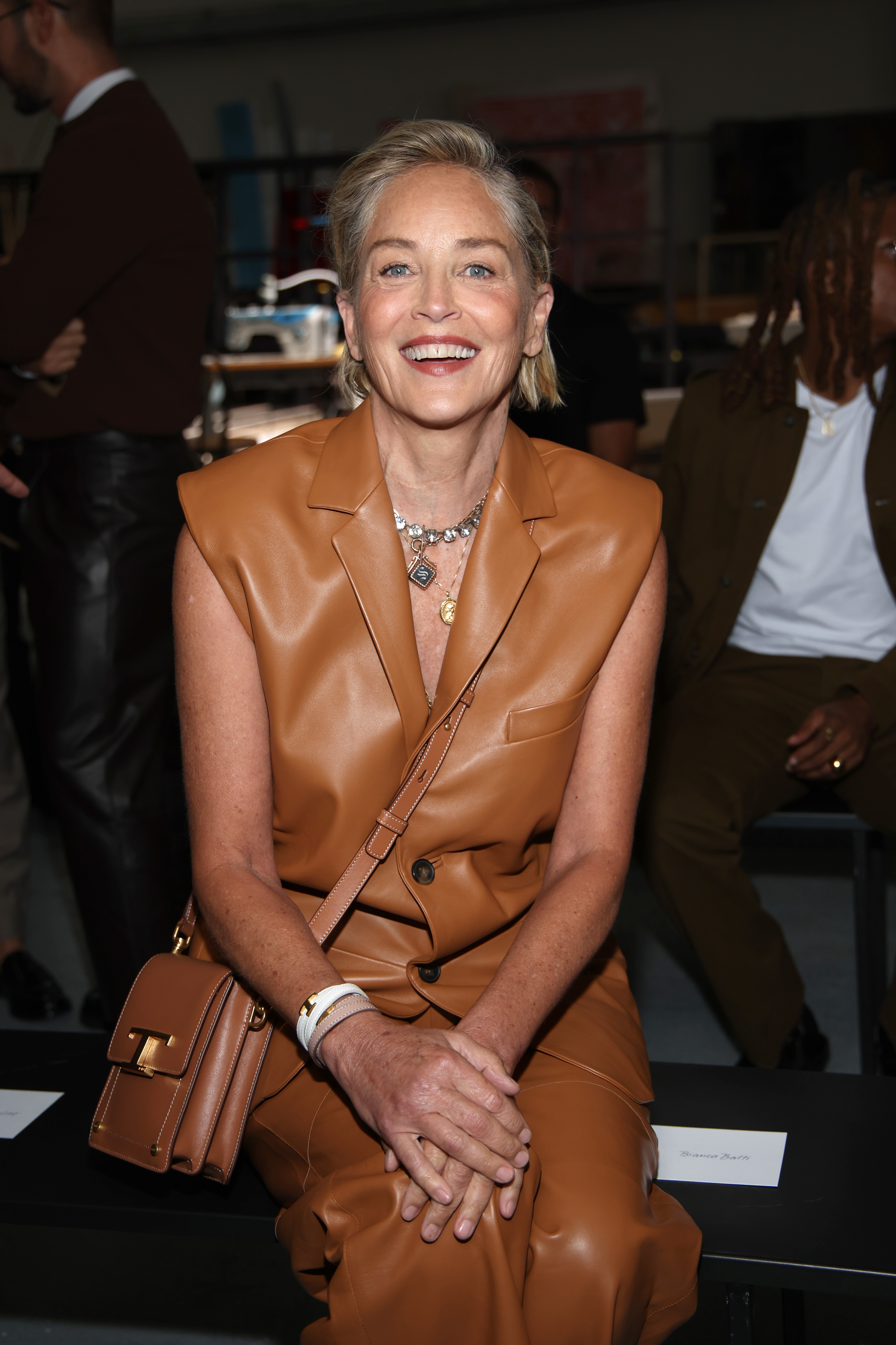 Sharon Stone in a brown leather dress. 