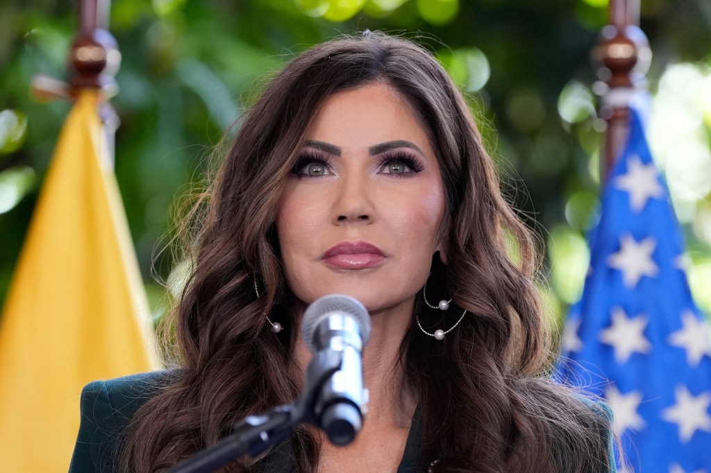 Kristi Noem speaking at a press briefing in Ecuador.