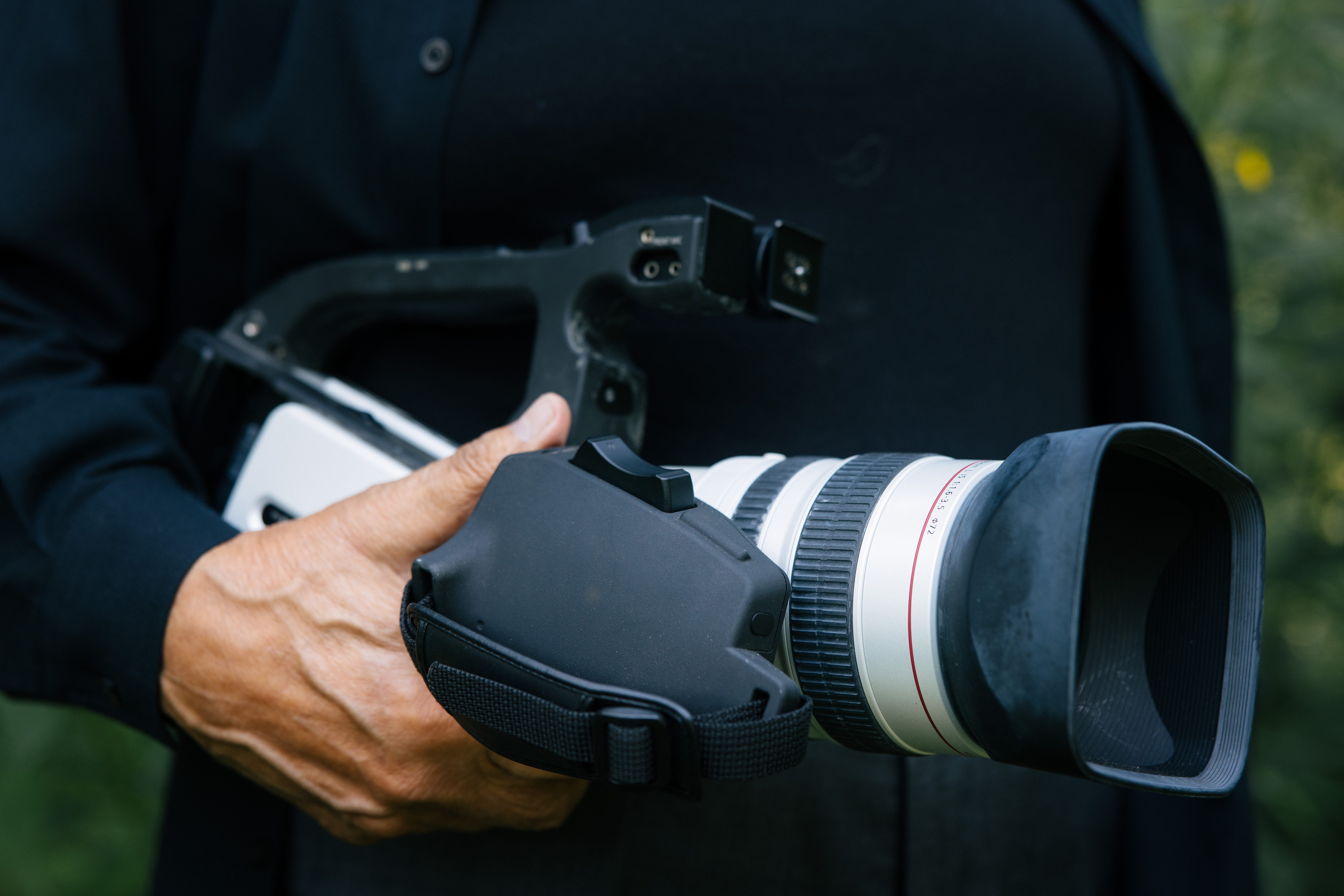 Henry Montez holds his camera
