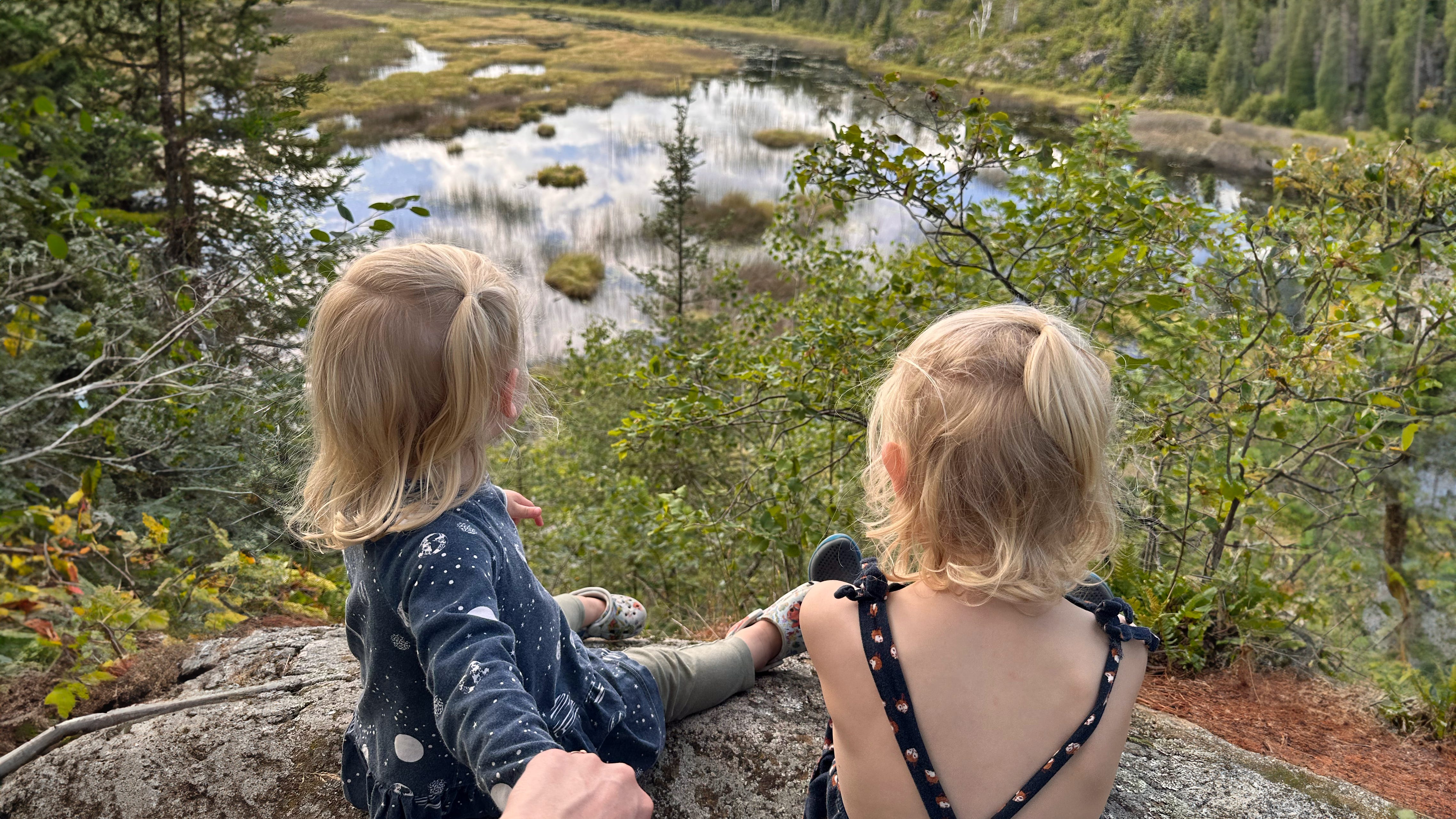 Two kids looking over a lake in Minnesota