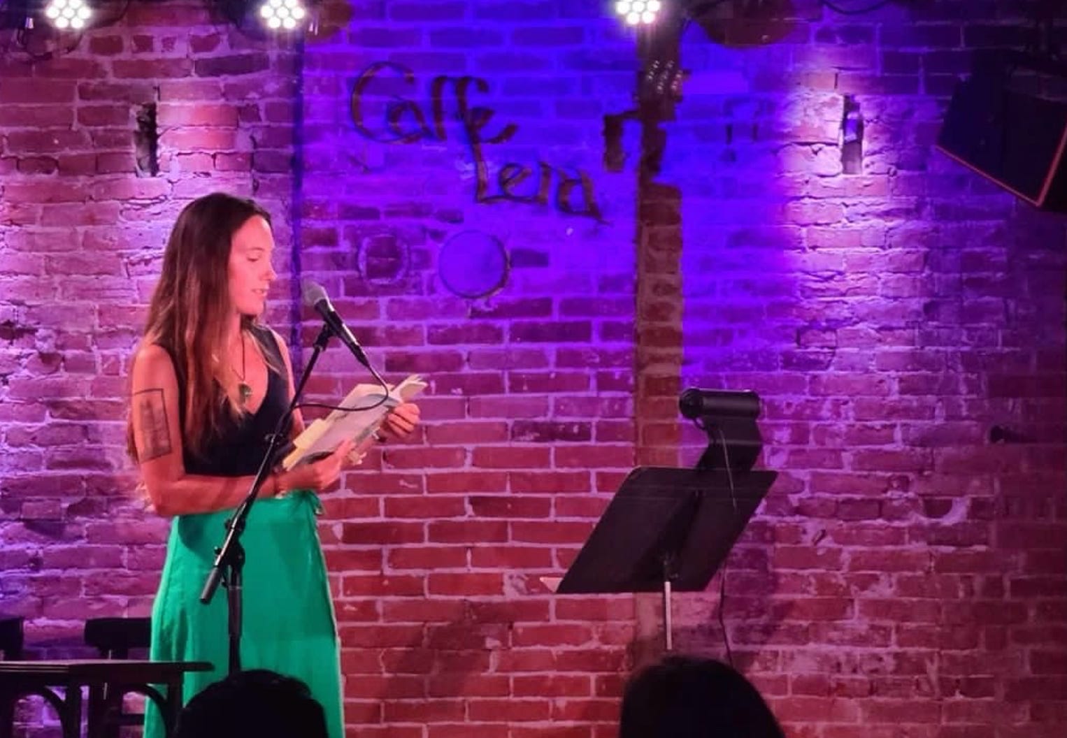 The writer at a reading in Saratoga Springs, New York.