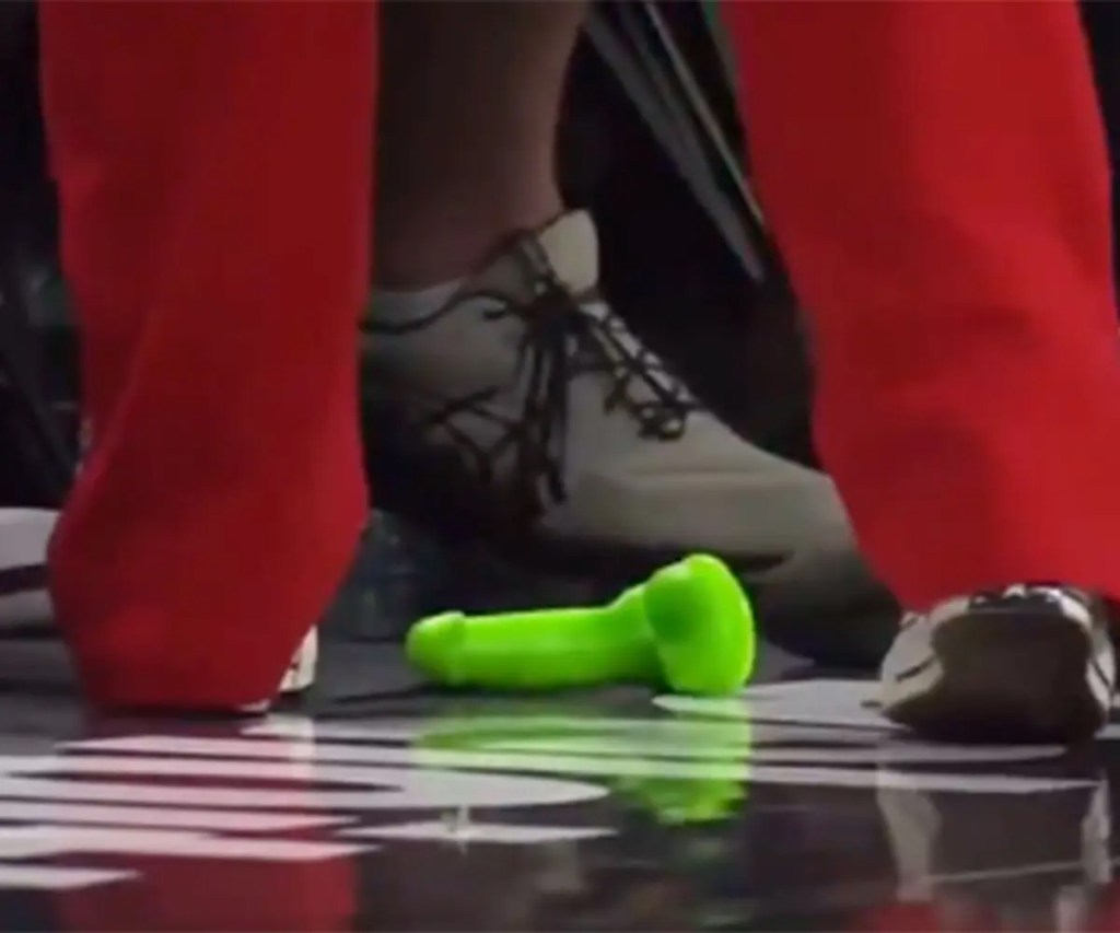 Lime green sex toy on a basketball court.