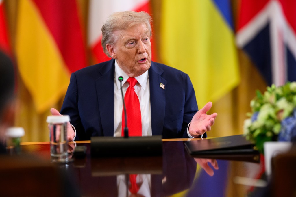 President Trump speaking at a multilateral meeting.