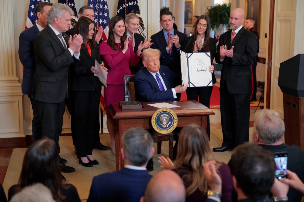 President Trump signing the Laken Riley Act.
