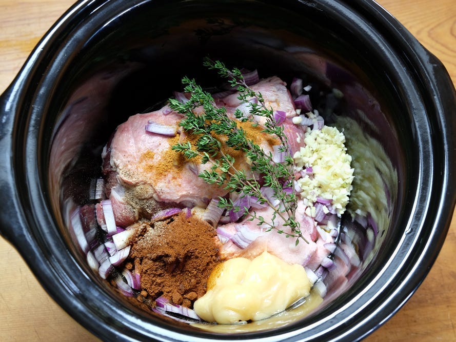 ingredients for pulled pork in a slow cooker