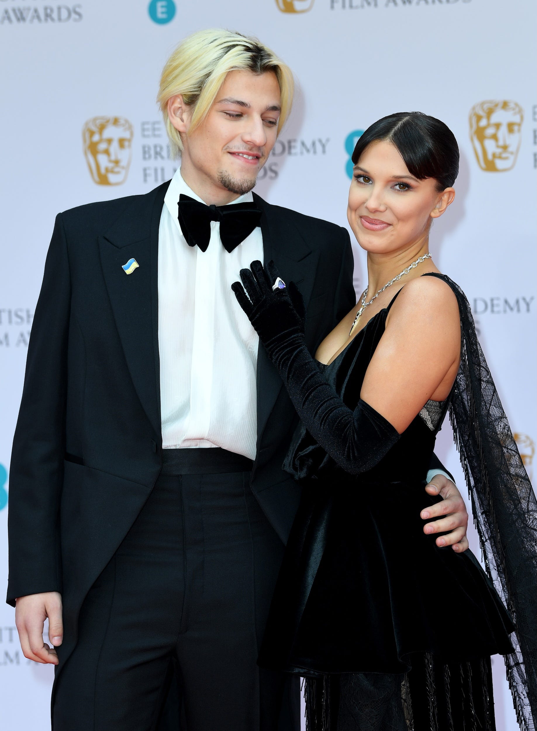 Jake Bongiovi and Millie Bobby Brown attend the 2022 EE British Academy Film Awards.