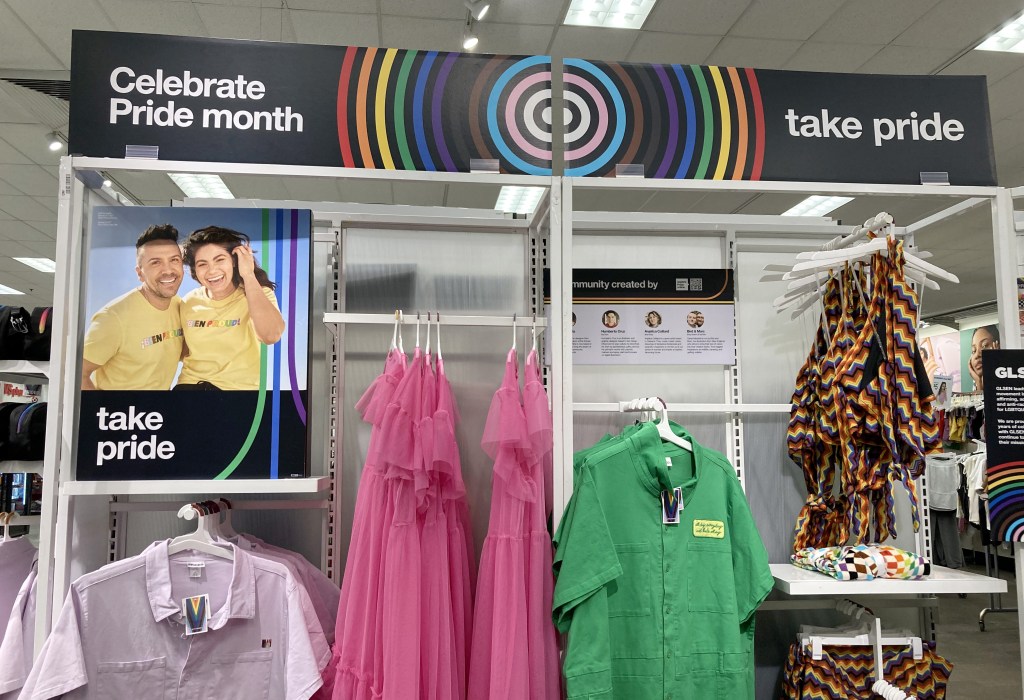 Target's Pride month collection display featuring clothing and accessories.