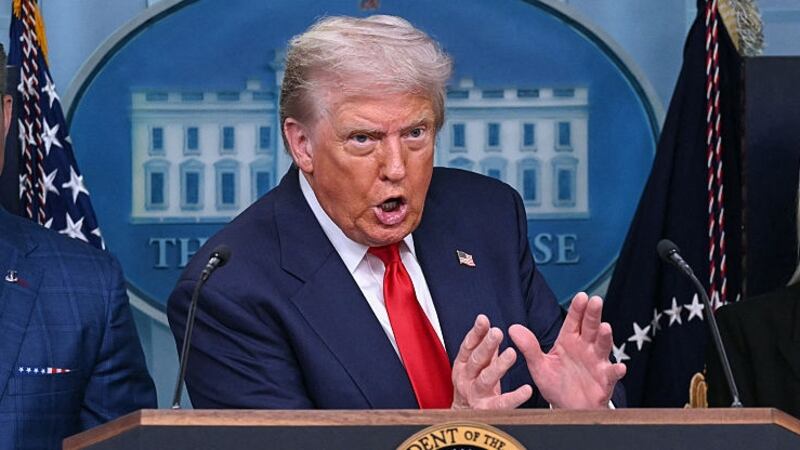 TOPSHOT - US President Donald Trump, alongside Secretary of Defense Pete Hegseth (L) and Attorney General Pam Bondi (R),  speaks during a news conference to discuss crime in Washington, DC, in the Brady Press Briefing Room at the White House in Washington, DC, on August 11, 2025. President Donald Trump announced Monday that he was deploying National Guard troops and putting the Washington police force under federal control to tackle crime in the US capital. 