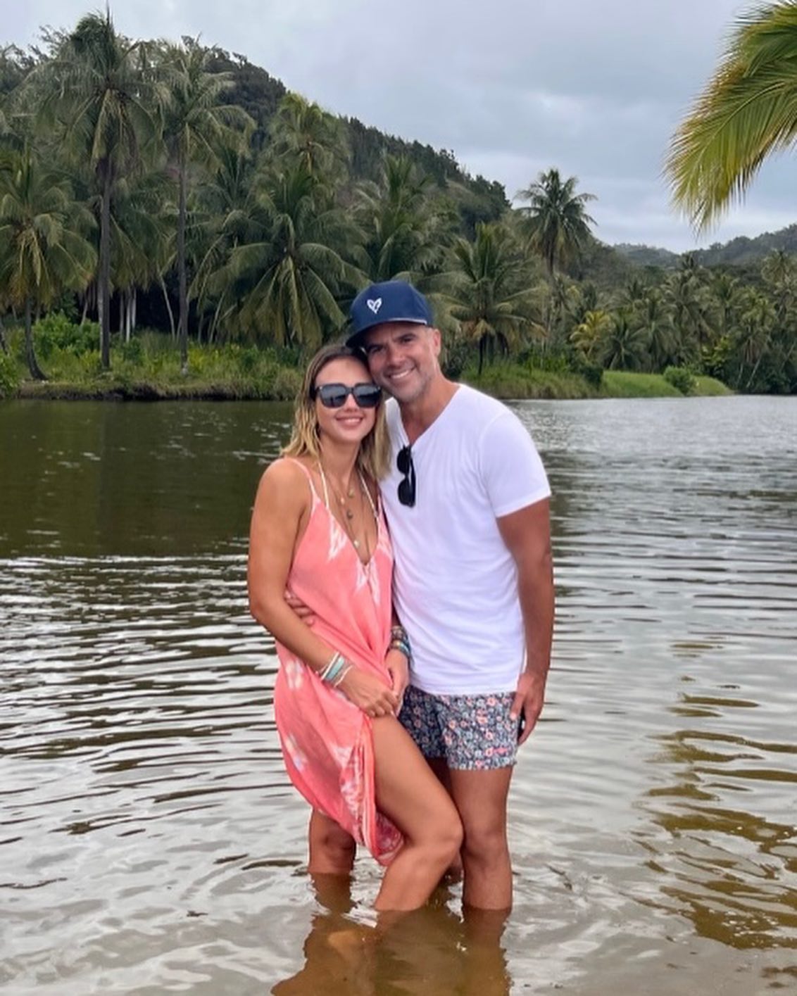 Jessica Alba and Cash Warren in the water. 