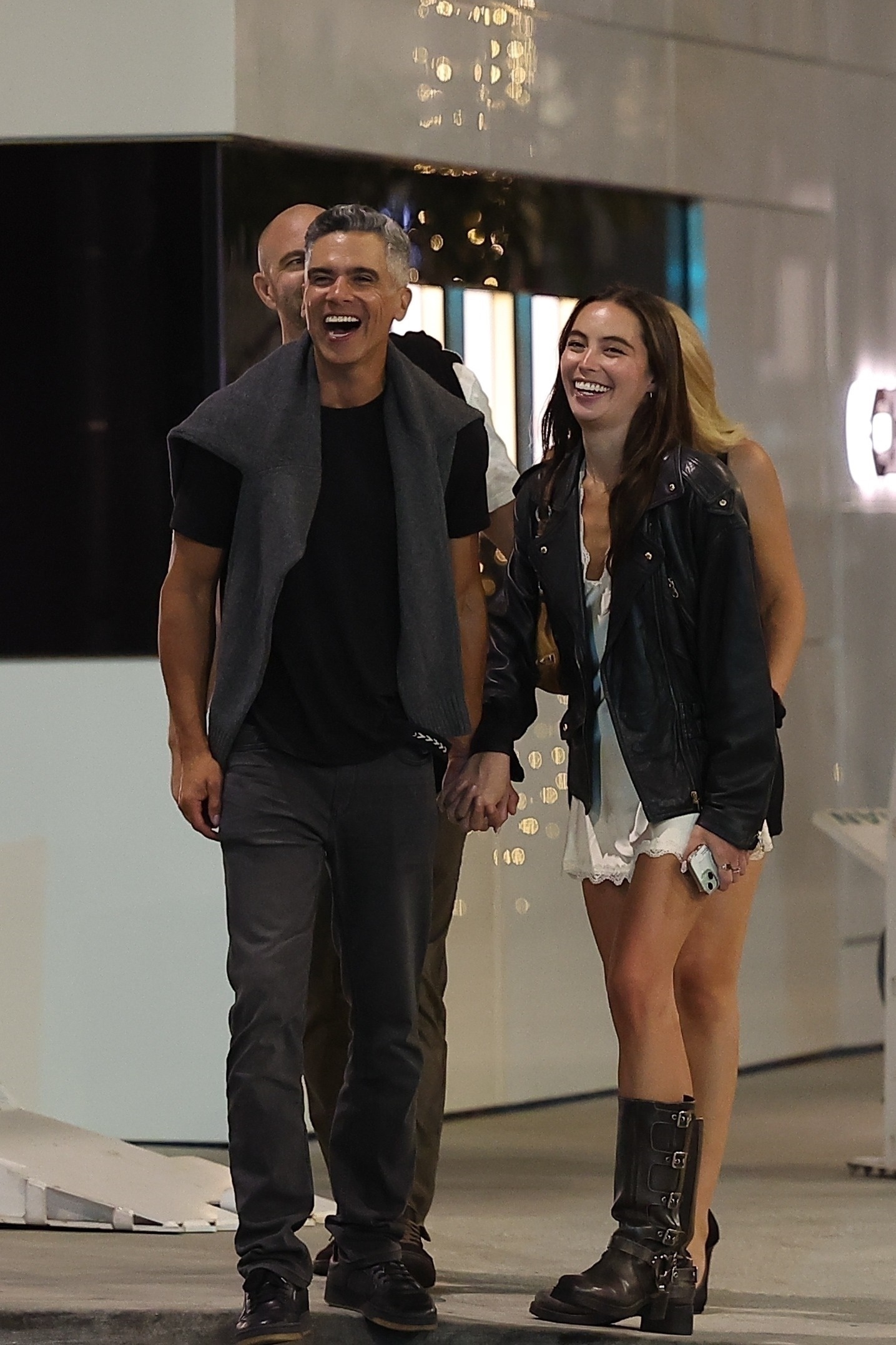 Hana Sun Doerr holding hands with Cash Warren. 