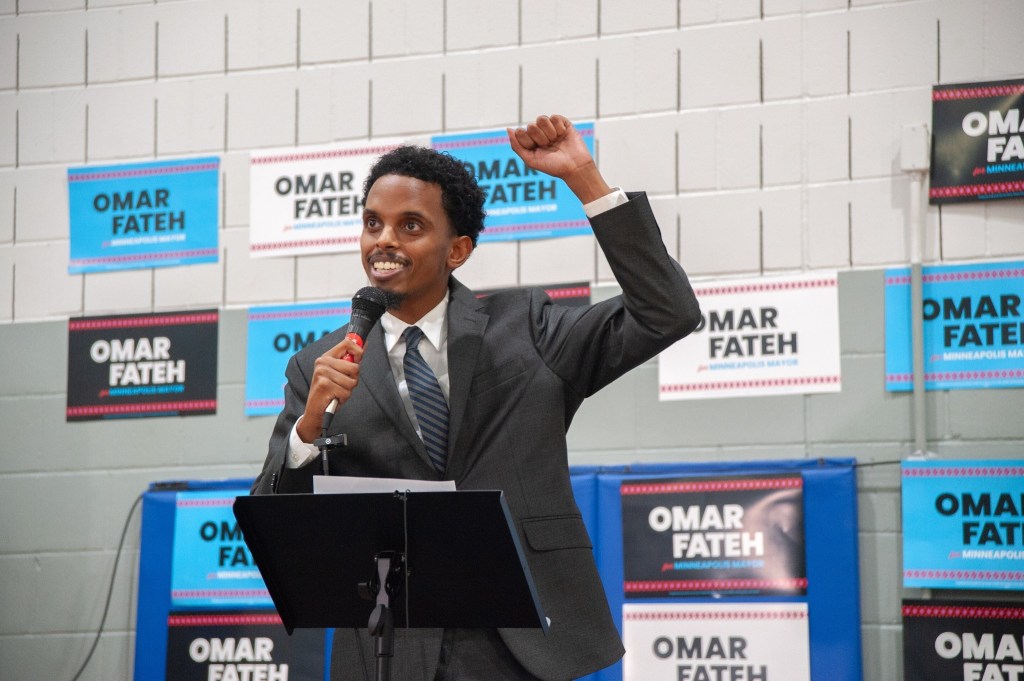 Omar Fateh speaking at a campaign event.