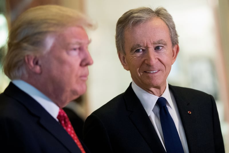 NEW YORK, NY - JANUARY 9: (L to R) President-elect Donald Trump and French businessman Bernard Arnault, chief executive officer of LVMH, speak to reporters at Trump Tower, January 9, 2017 in New York City. President-elect Donald Trump and his transition team are in the process of filling cabinet and other high level positions for the new administration. (Photo by Drew Angerer/Getty Images)