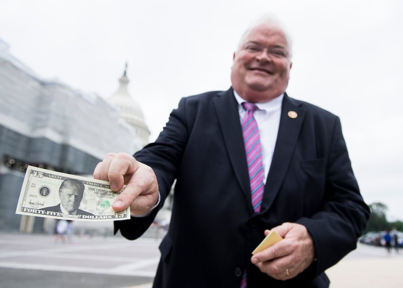 Former Rep. Billy Long flaunting his $45 Trump bills.
