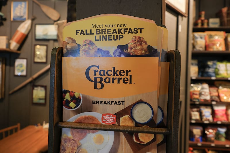 The new Cracker Barrel logo is seen on a menu inside the restaurant on August 21, 2025 in Homestead, Florida. The restaurant unveiled a new logo earlier this week as part of a larger brand refresh. The new logo removes the image of a man sitting next to a barrel and the phrase “old country store”. Now the logo will feature the words “Cracker Barrel” against a yellow background. (Photo by Joe Raedle/Getty Images)