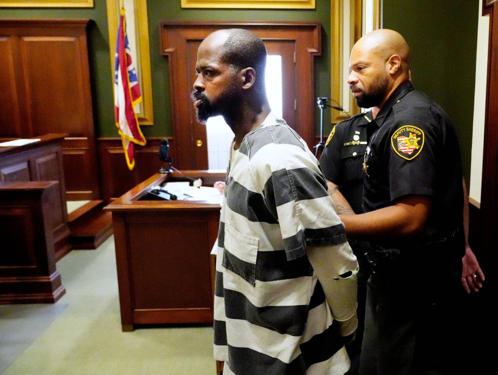 Dominique Kittle is escorted into Hamilton County Common Pleas Courtroom during his arraignment on Aug. 14, 2025.