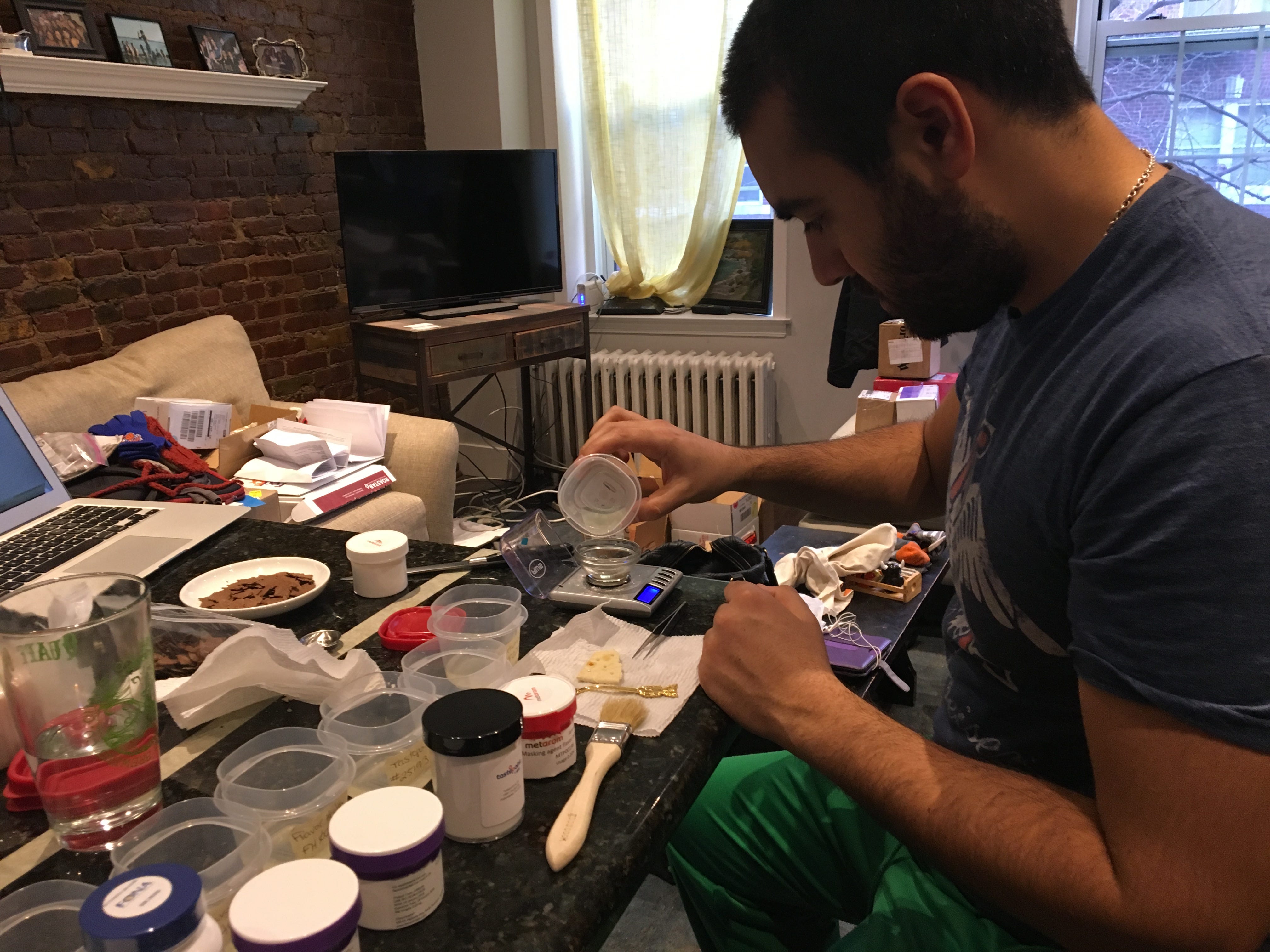 Krishna Kaliannan puts together ingredients in his living room