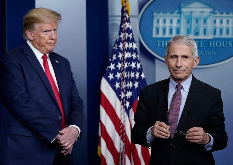 WASHINGTON, DC - APRIL 22: Dr. Anthony Fauci (R), director of the National Institute of Allergy and Infectious Diseases, and U.S. President Donald Trump participate in the daily coronavirus task force briefing at the White House on April 22, 2020 in Washington, DC. Dr. Robert Redfield, director of the Centers for Disease Control, has said that a potential second wave of coronavirus later this year could flare up again and coincide with flu season. (Photo by Drew Angerer/Getty Images)