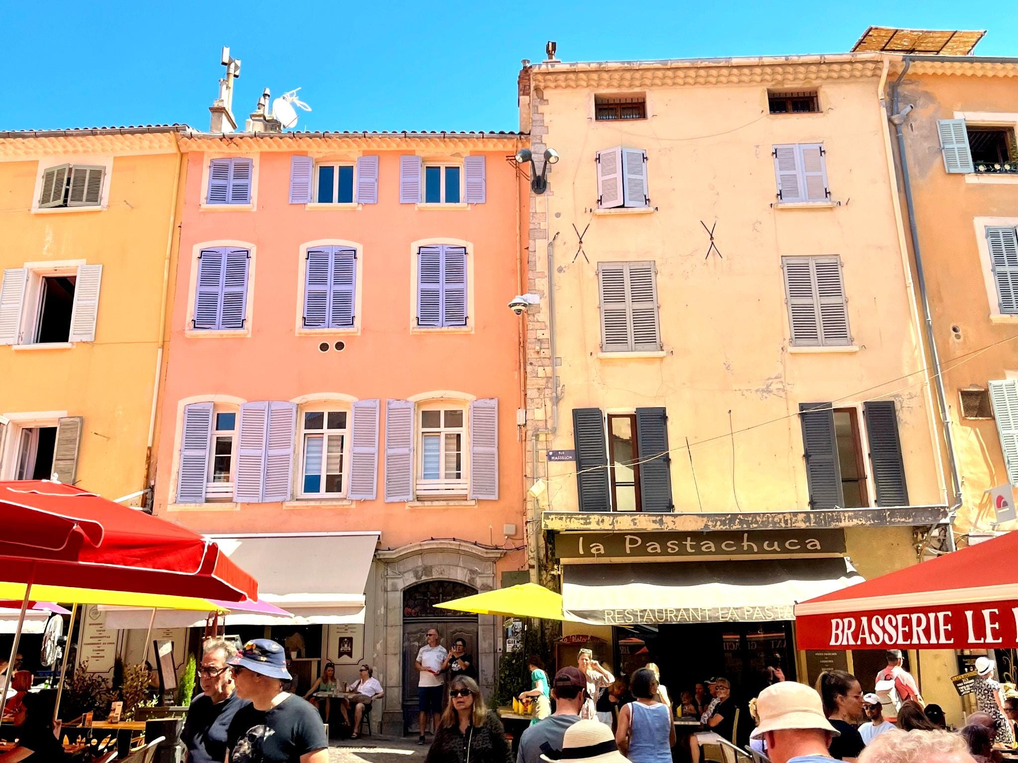 colorful buildings lines with restuarants in France