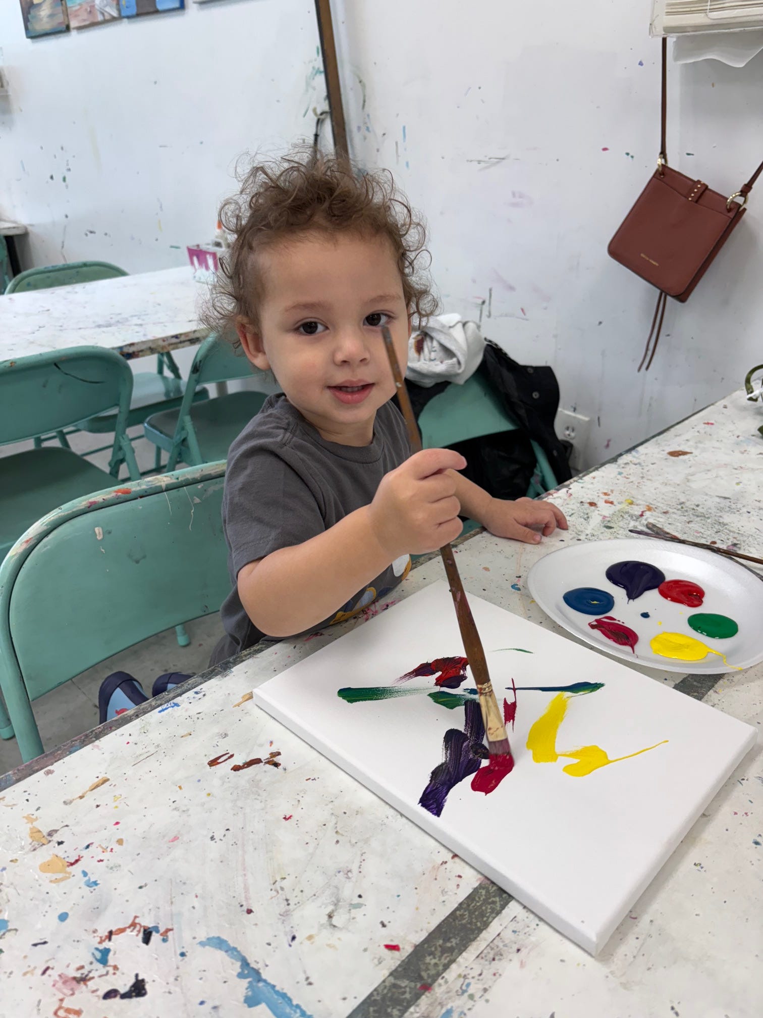 The author's son painting a canvas.