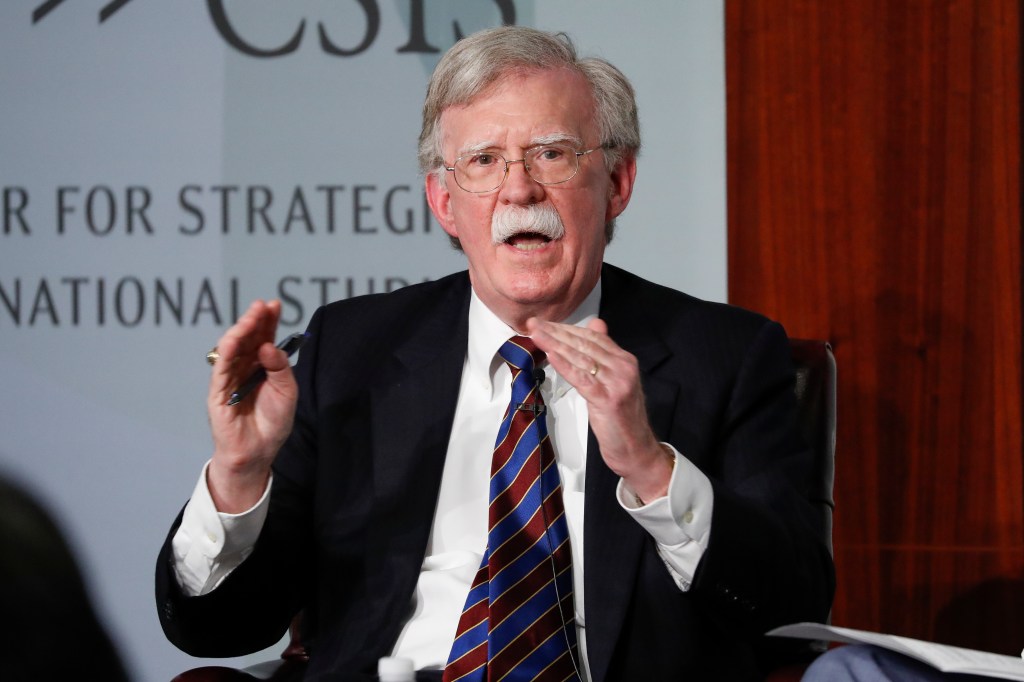 John Bolton speaking at a conference.