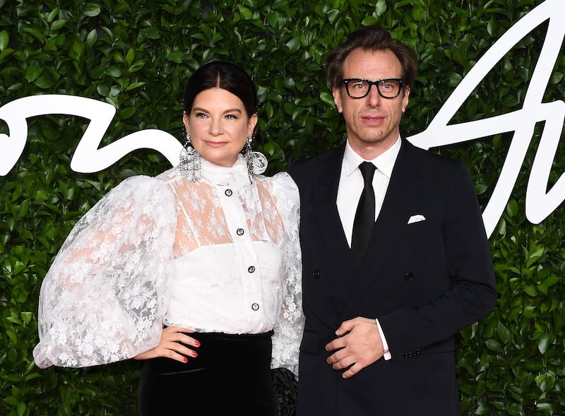 Dame Natalie Massenet (L) and Erik Torstensson arrive at The Fashion Awards 2019 held at Royal Albert Hall on December 02, 2019 in London, England.