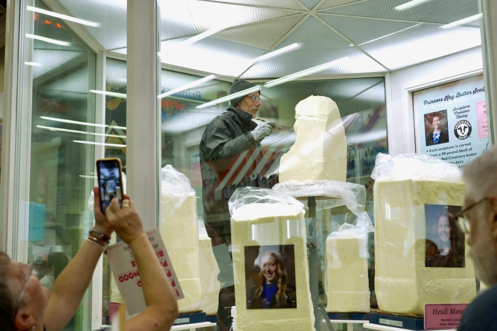 Sculptor carving a butter sculpture of Princess Kay of the Milky Way.