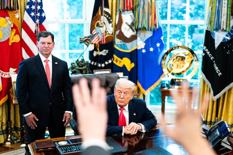 President Donald Trump displays the Club World Cup trophy, made up of a 24-carat gold-plated finish over a sterling silver base, behind his desk these days.