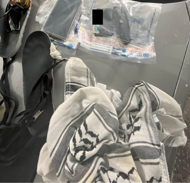Items seized from San Francisco mob assault on ICE: sandals, keffiyeh, wallet, phone, and ID.