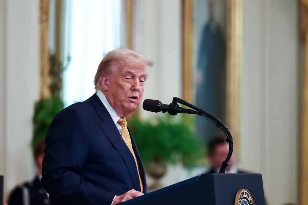 President Trump speaking at a podium.