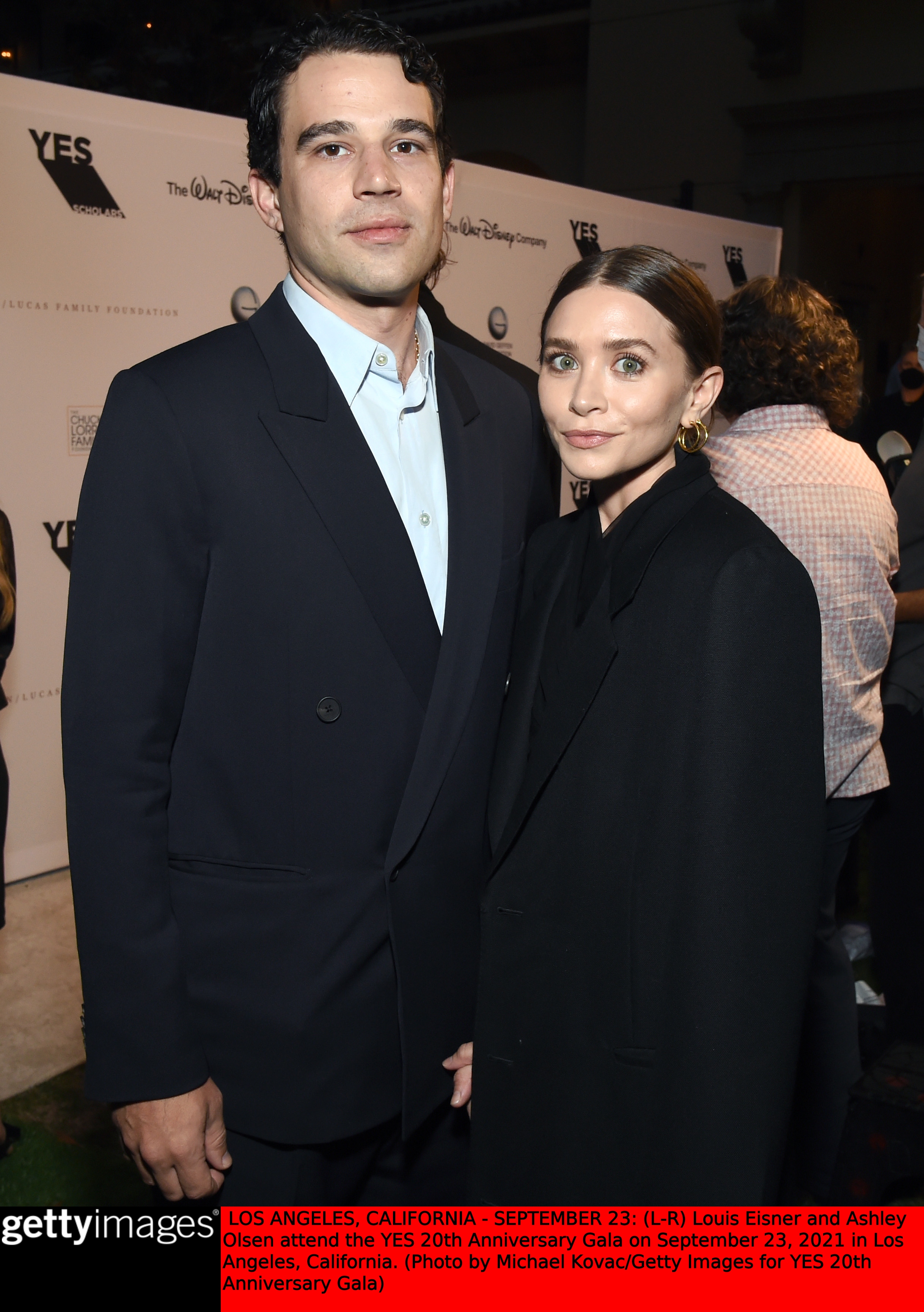 Ashley Olsen and Louis Eisner at an event. 