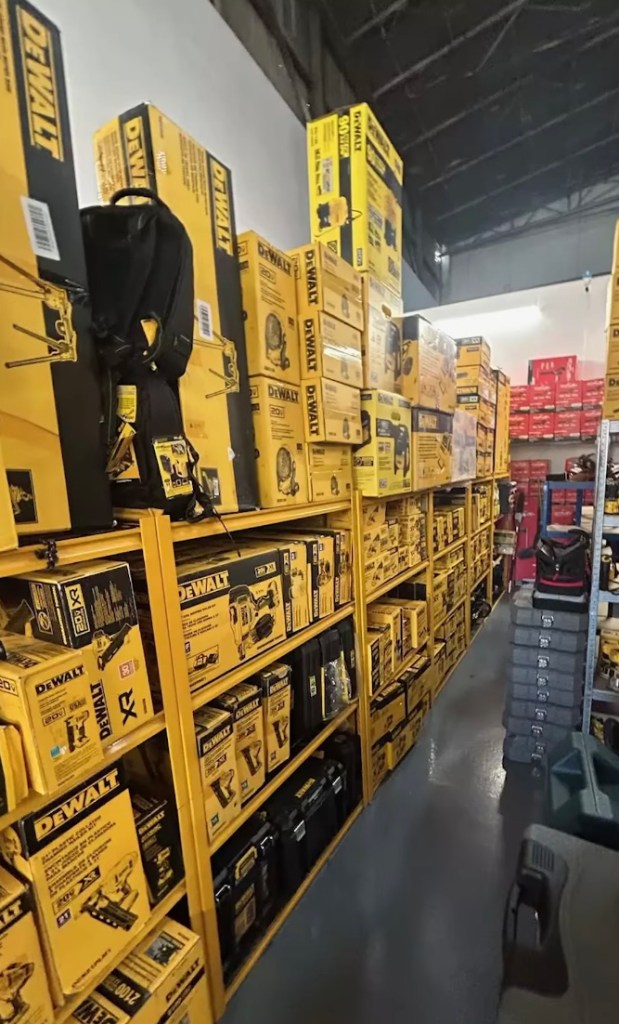 Authorities displayed stacks of recovered stolen merchandise seized during the investigation.