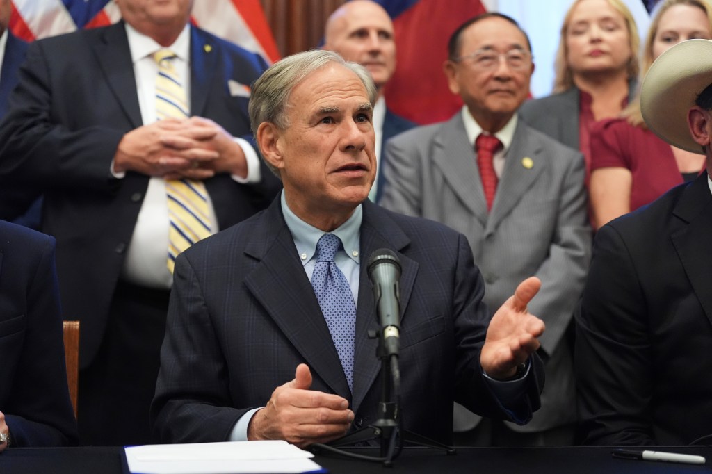 Texas Gov. Greg Abbott speaks to reports during a bill signing on Aug. 22, 2025.
