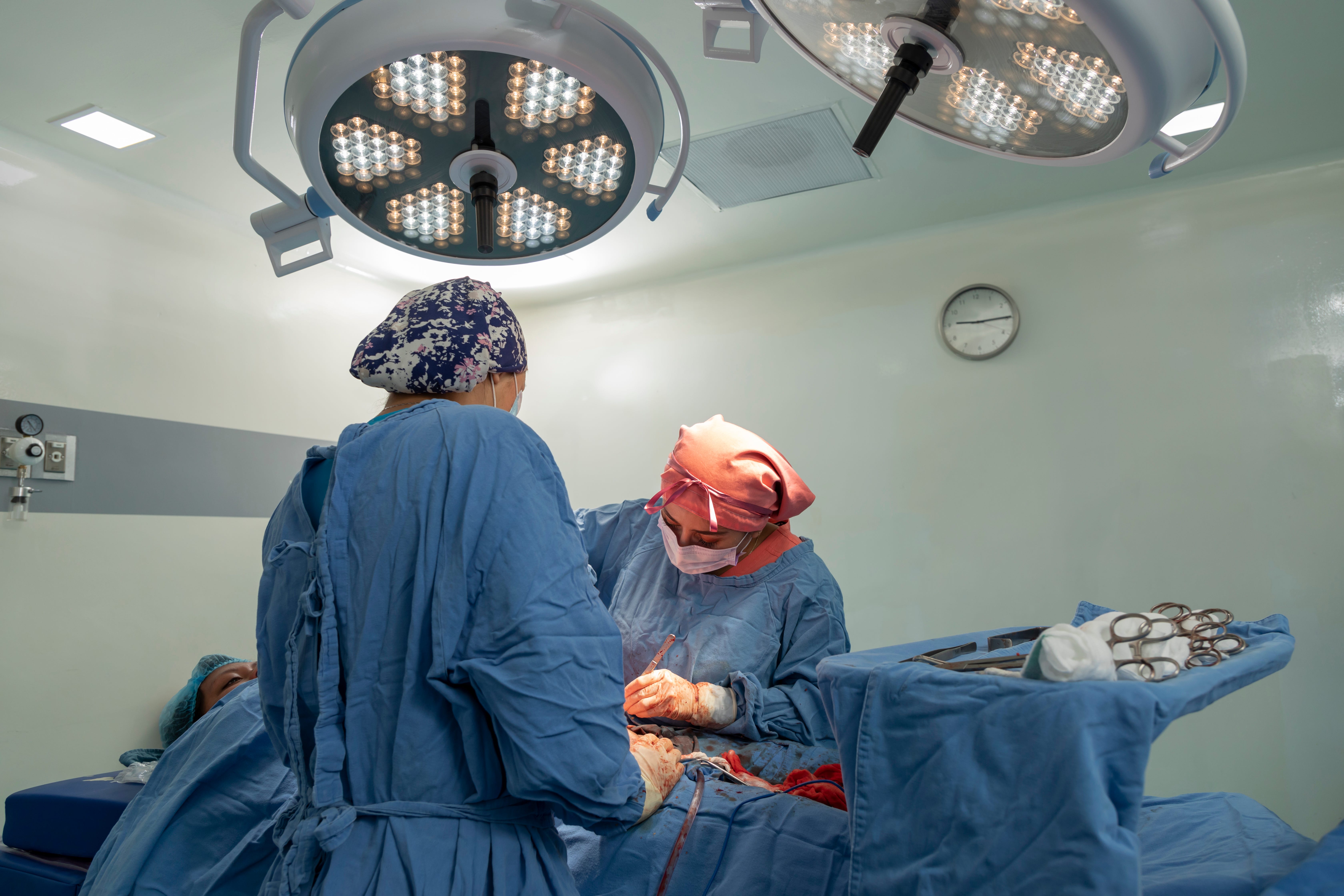 two surgeons performing a c section