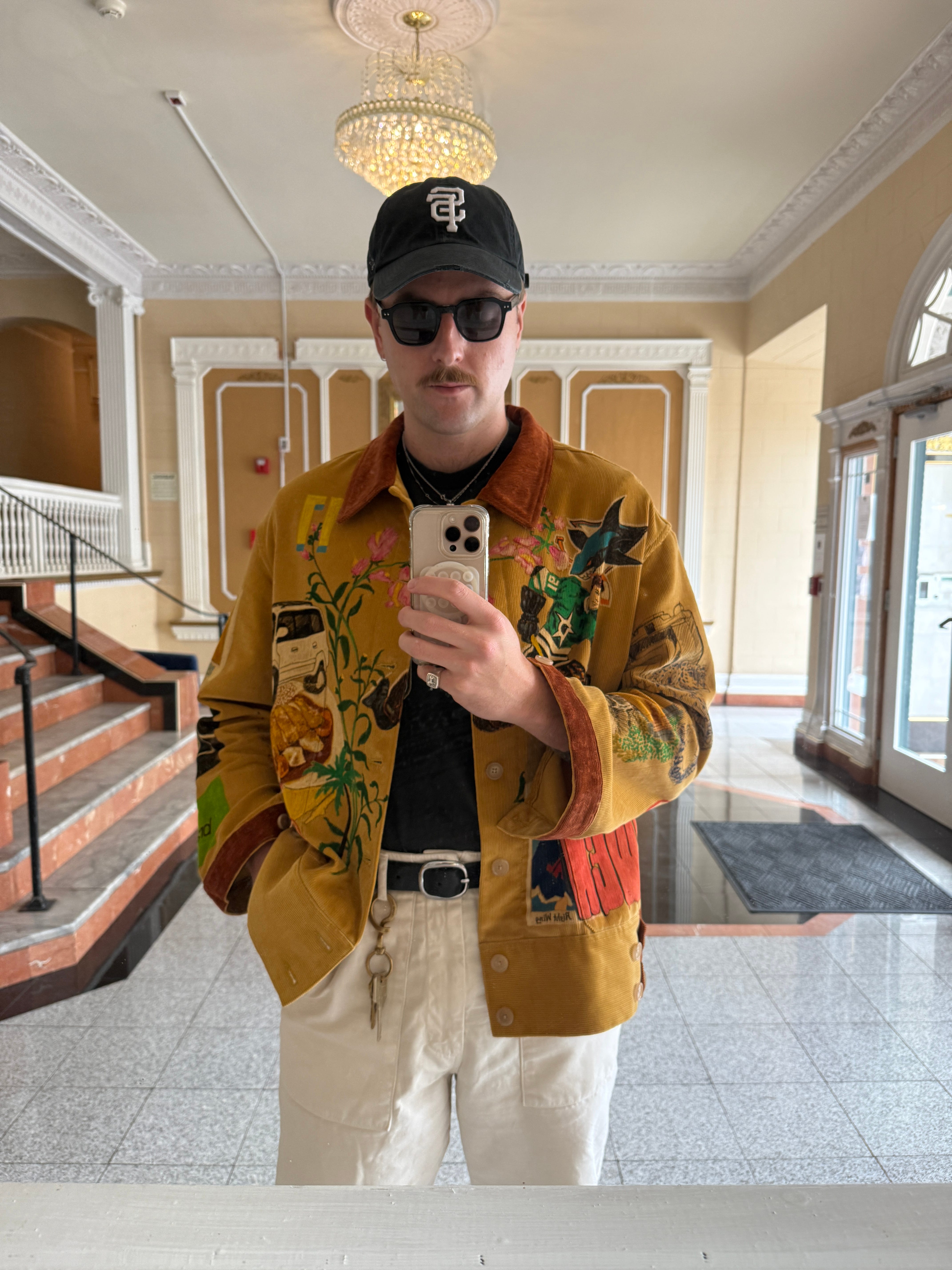 Marc Bass wears his custom Bode jacket.