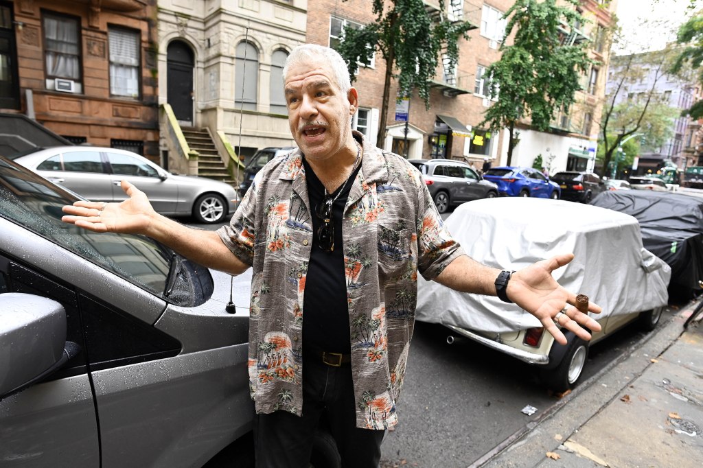 Abraham Pariente raising his hands in front of his parked vehicle in the Upper West Side on Aug. 21, 2025