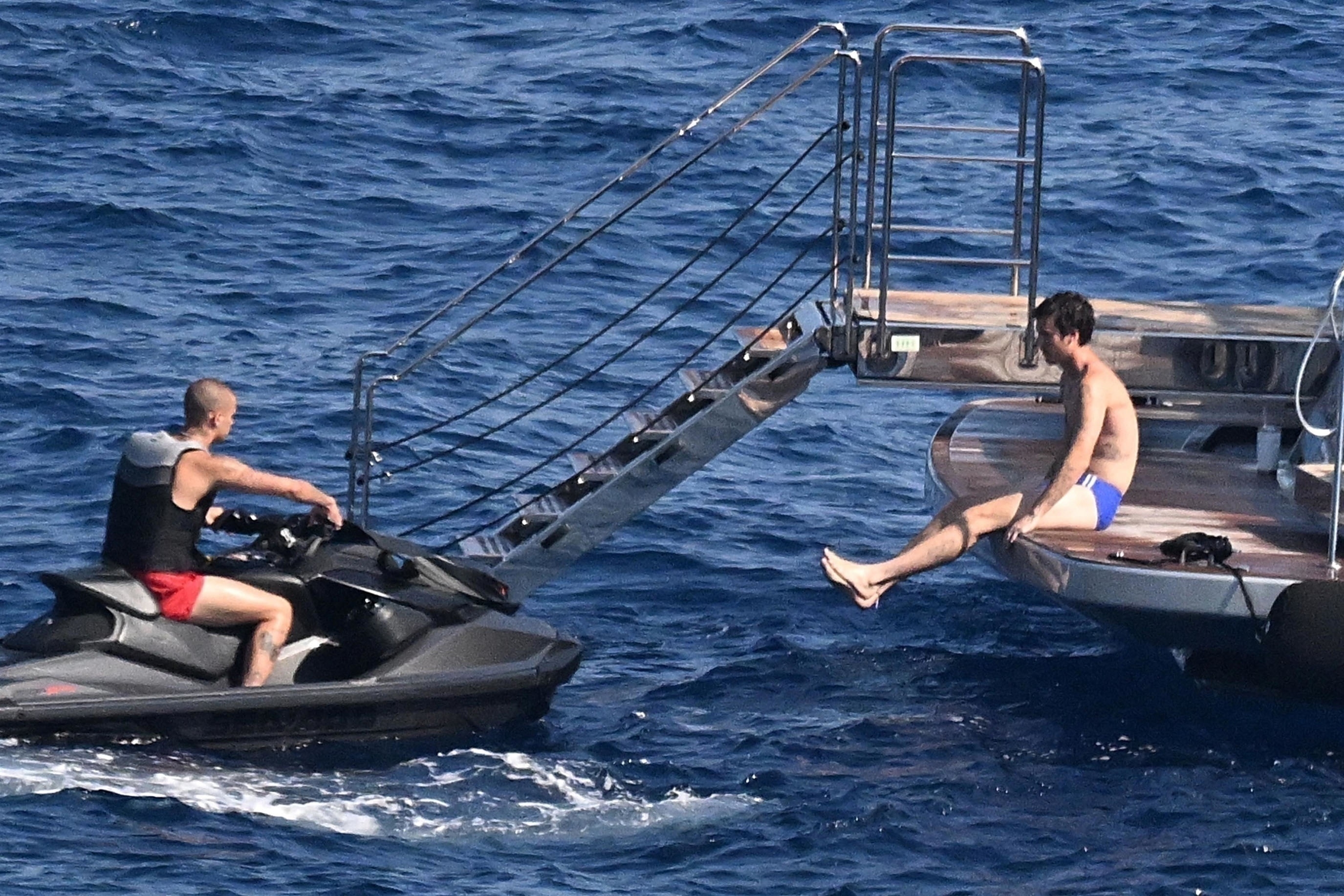 Cruz and Romeo Beckham on a yacht